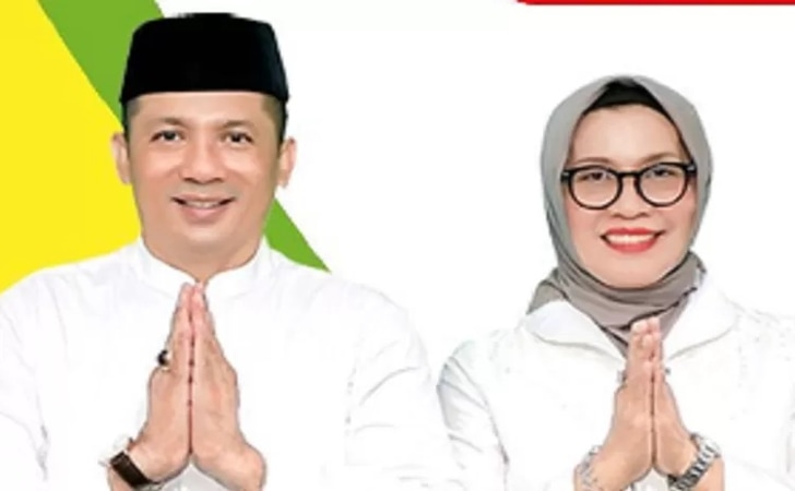 Bupati-Meranti-dan-istri.jpg