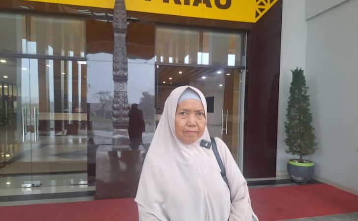 Hasnimelaporkan-ke-polda-riau.jpg