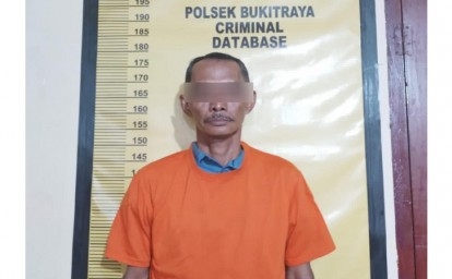 Pelaku-pemerasan-di-polsek-bukitraya.jpg